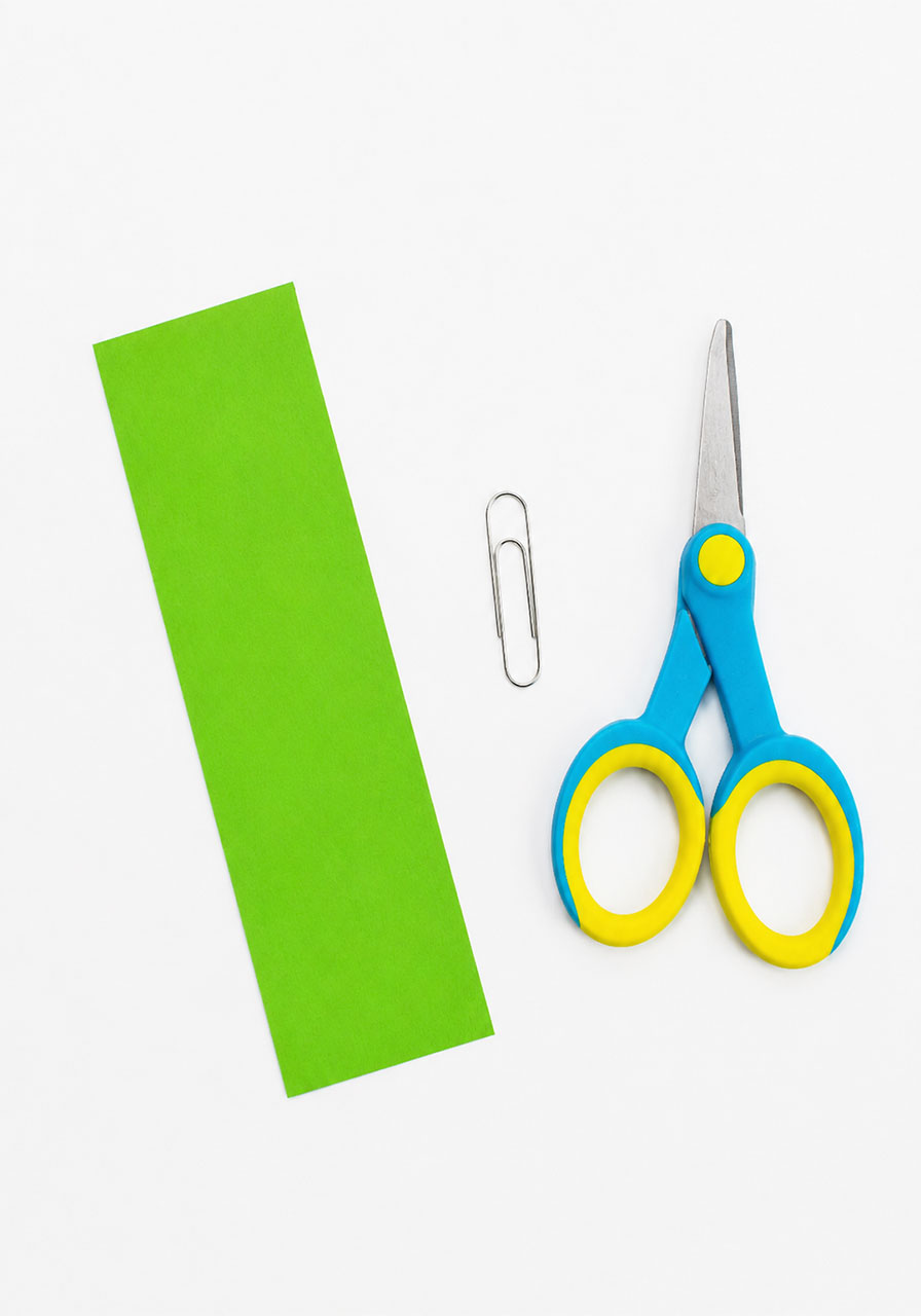 Simple materials needed for paper helicopters: cardstock, scissors, and a paper clip