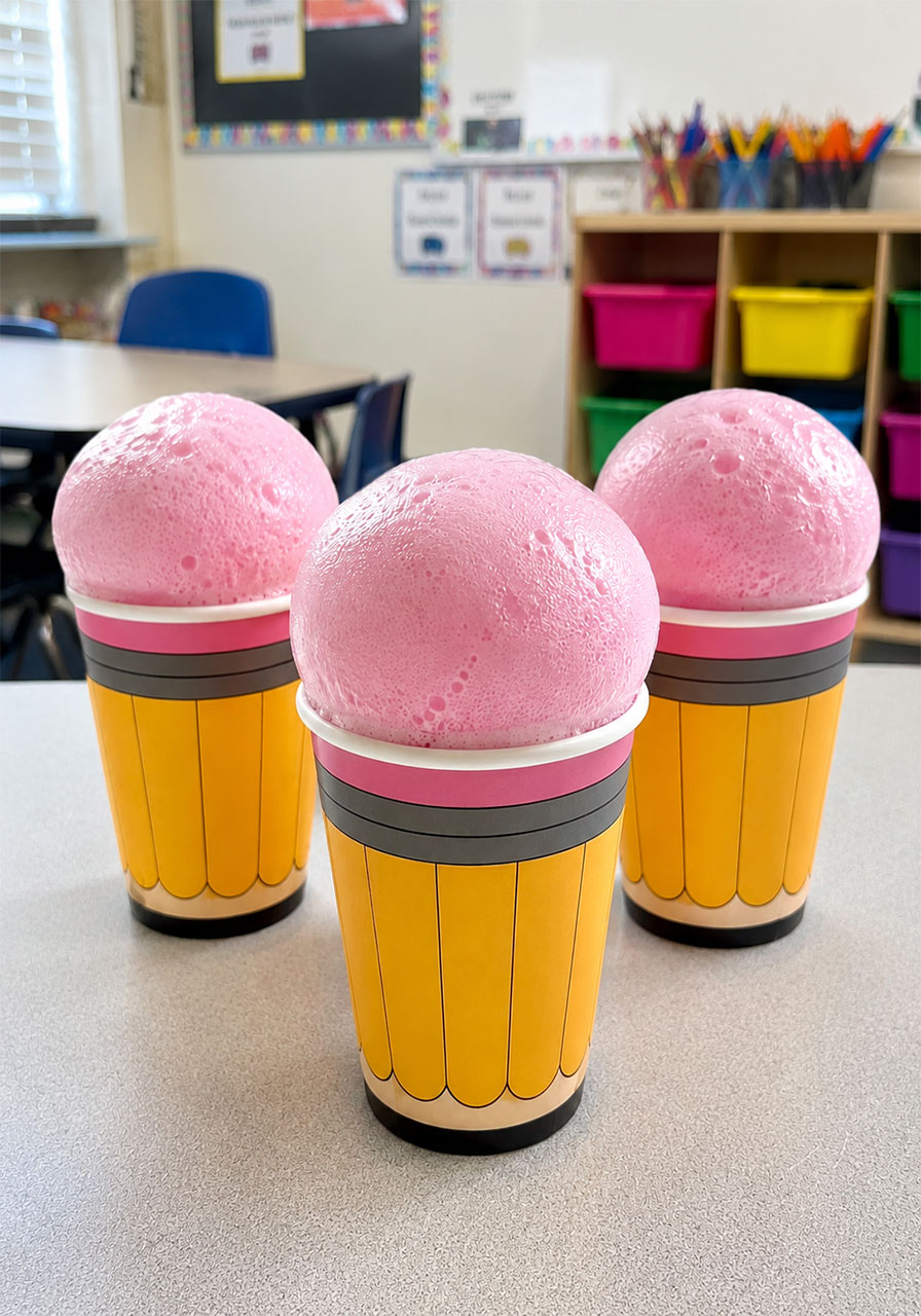 Three paper cup pencils with pink foam eruption for Pencil Blasters science experiment for kids
