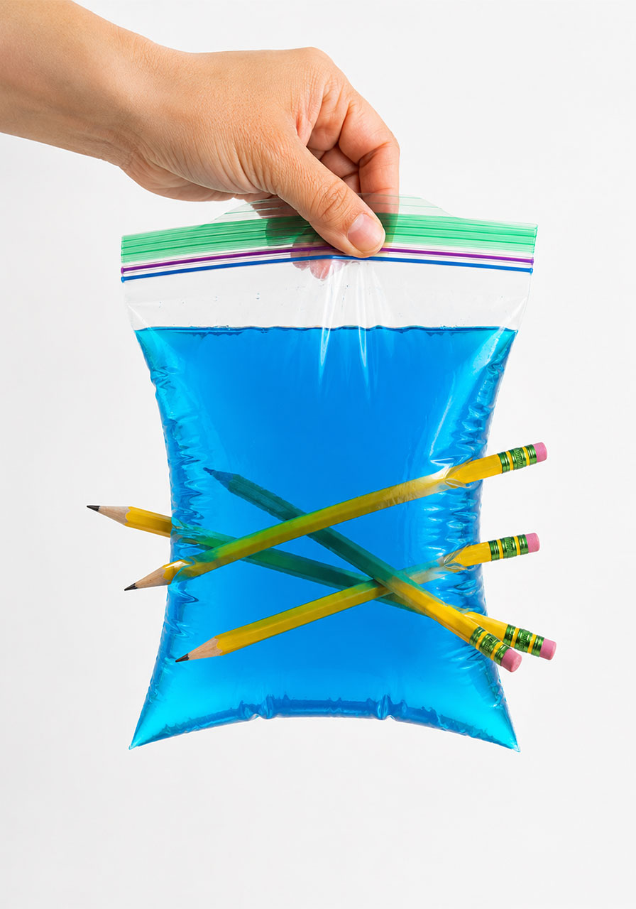 Colorful variation of the pencil in water bag experiment using blue food coloring