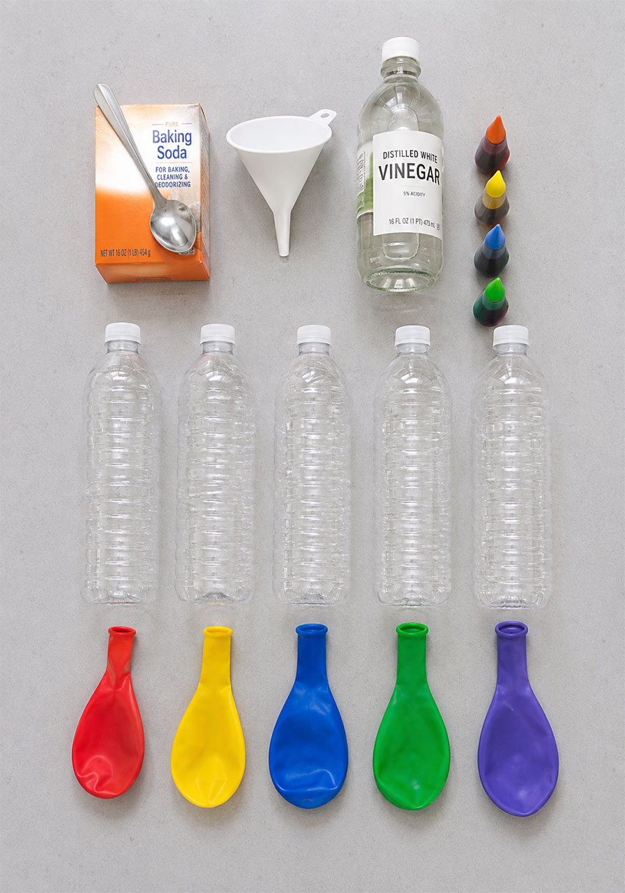Materials needed for the rainbow balloon experiment including vinegar, baking soda, and balloons
