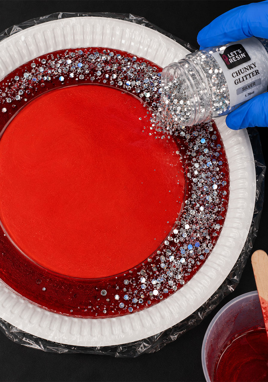 Adding chunky silver glitter to resin for sparkly Halloween ghost