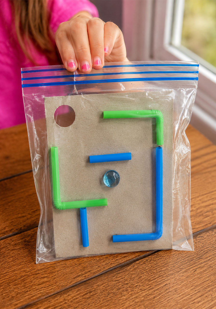 Sealing plastic baggie for screen-free marble maze activity