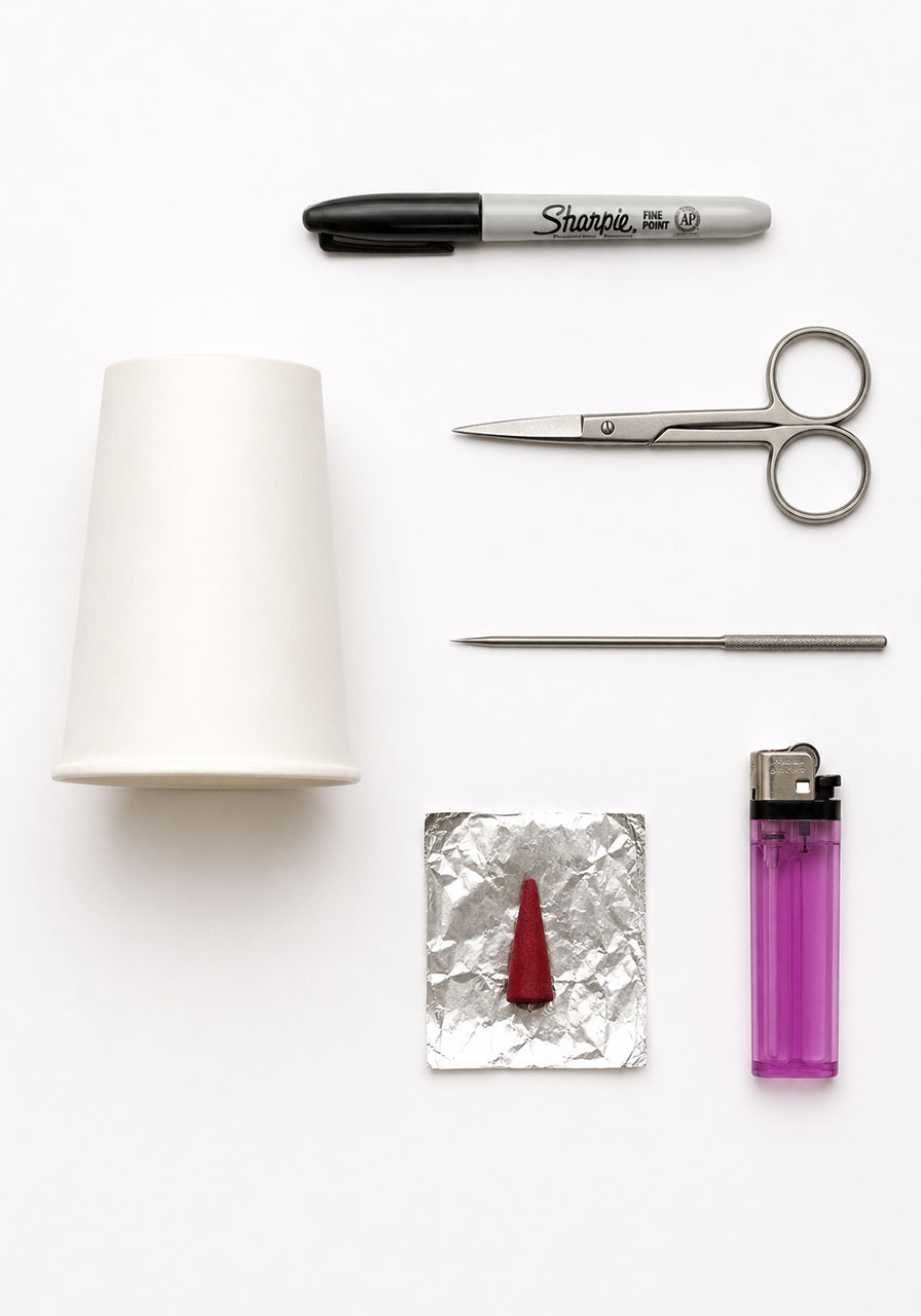 Supplies needed for the paper cup smoke ring experiment laid out on a table