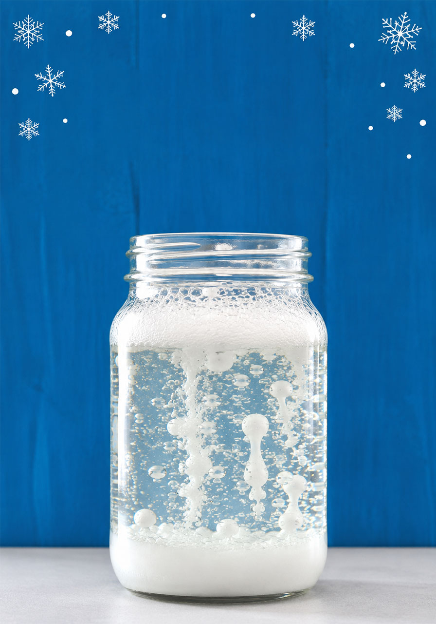 Winter science experiment Pinterest pin showing snowstorm in a jar for kids