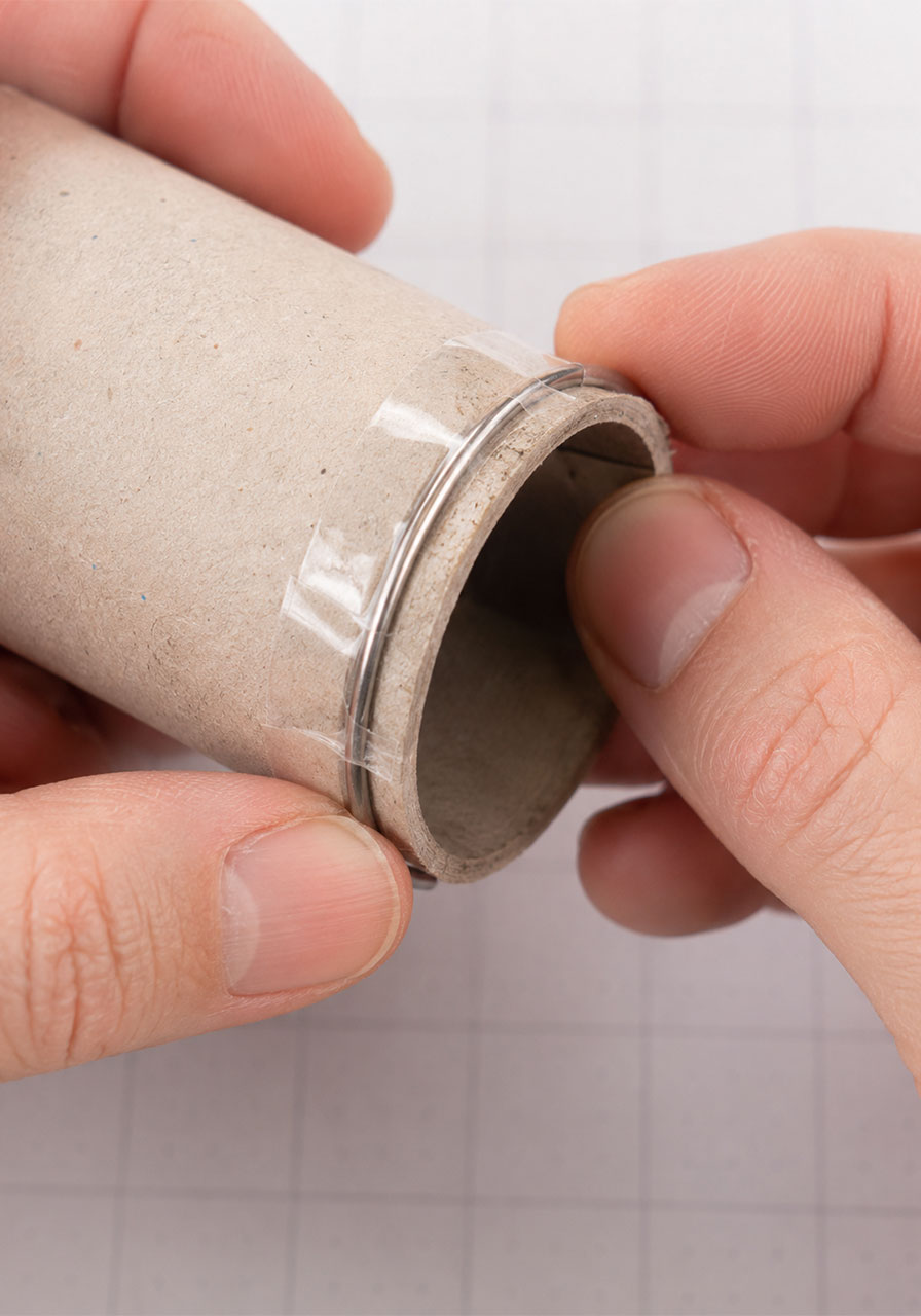 Wire stop ring taped around a cardboard tube to hold the spectrometer cap in place